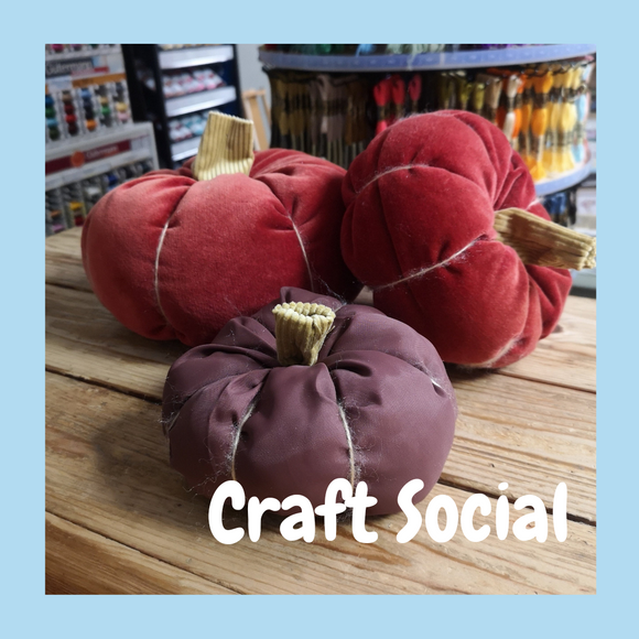 3 fabric pumpkins displayed on a wooden table. Print reads 'Craft Social'