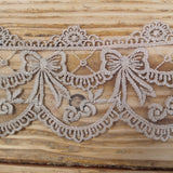 Embroidered lace bows - putty 70mm