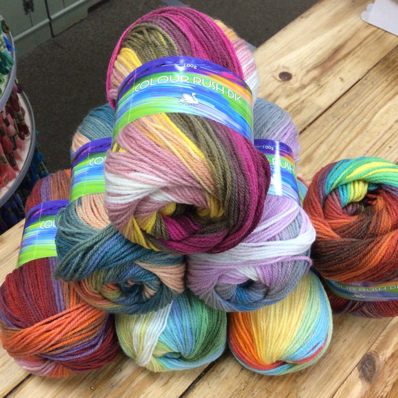 pyramid of multi colour balls of Cgnet Colour Rush DK yarn.