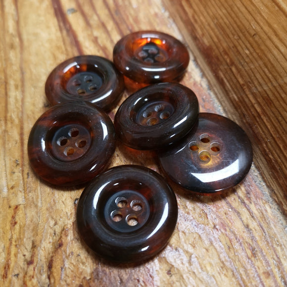 Amber 4-hole button with deep centre and rounded rim 28mm