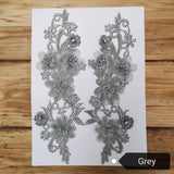 Pair of lace applique panels in grey